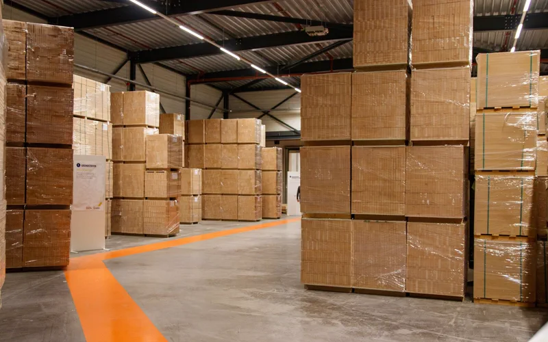 Cardboard boxes stacked on pallets in a warehouse