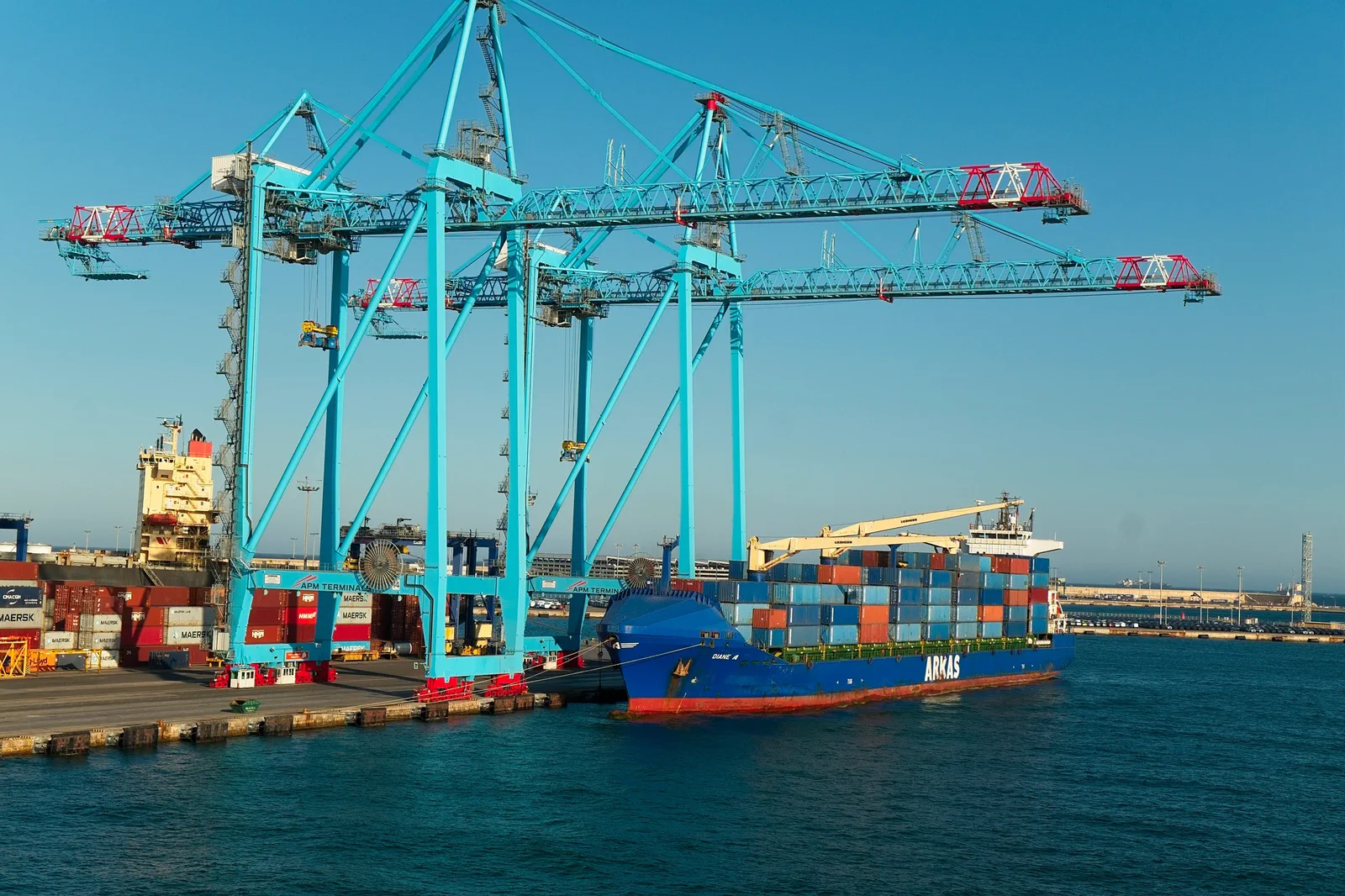 Harbour cranes and a container ship at the quay